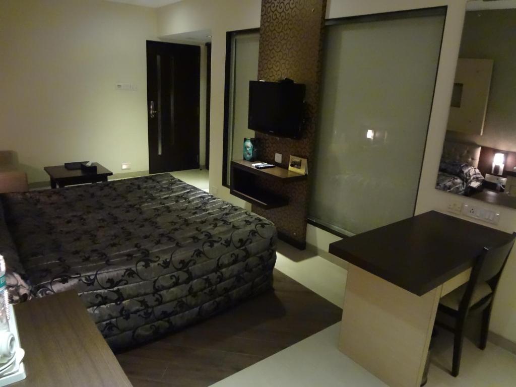 Hotel Capitol Thane Ruang foto