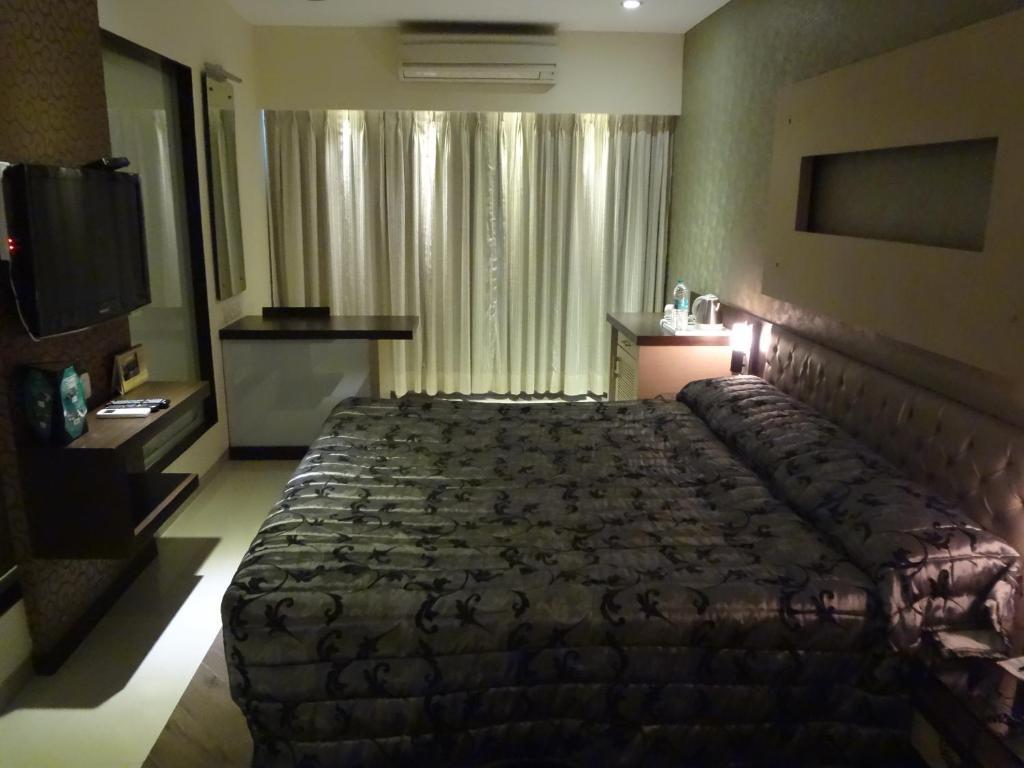 Hotel Capitol Thane Ruang foto